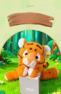 Close-up of cute plush tiger toy in lying position with realistic orange and black stripes