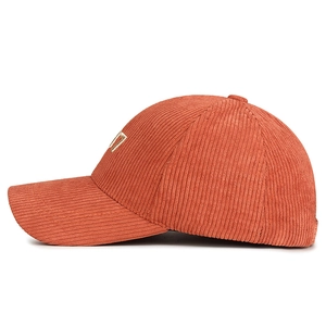 Retro orange corduroy baseball cap with embroidered number seven and curved brim