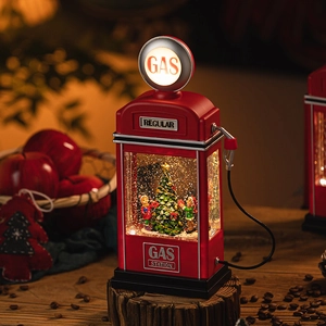 Vintage red Christmas gas station snow globe lamp with warm LED lights and tree