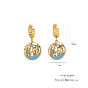 Detail view of gold stainless steel turtle and palm tree earrings with size dimensions