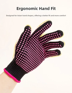 Detail view of black heat resistant glove with pink silicone non-slip dots for hair styling