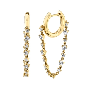 Elegant gold hoop earrings with sparkling white zircon tassels on a white background