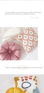 Detailed close-up of velvet pleated pumpkin cushions and tufted embroidery texture