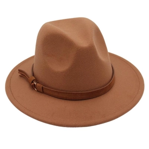 Close-up of caramel brown fedora hat featuring dark leather band with gold metal buckle