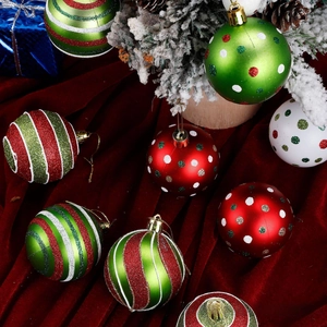 Detailed view of festive Christmas balls with glitter and patterns on velvet and cedar