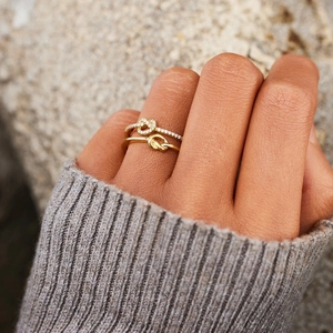 S925 sterling silver double layered heart knot rings with gold finish on finger