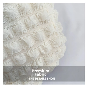 Macro shot of the white popcorn bubble texture fabric on this casual shoulder bag