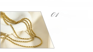 Detail of 18K gold-plated titanium steel rope chain showing high-polish finish