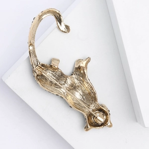 Detail view of the vintage leopard brooch back showing secure pin fastening and gold finish