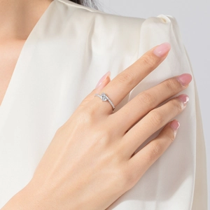 Elegant S925 sterling silver heart ring with sparkling zircons worn by a model