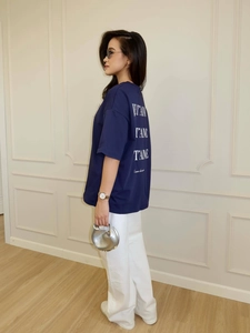 Side view of navy oversized t-shirt with white JET'AIME back print and wide-leg trousers