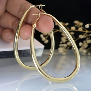 Classic large golden teardrop hoop earrings with high-polish finish and hook closures