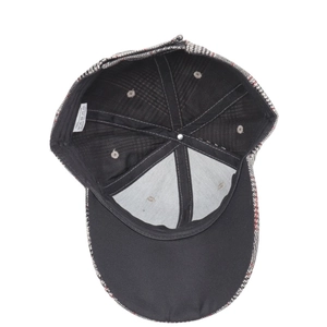 Detail view of the 100% cotton houndstooth baseball cap interior and washing label