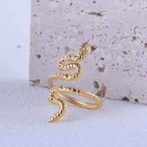 Detailed close-up of golden snake ring showing intricate scale textures on stainless steel