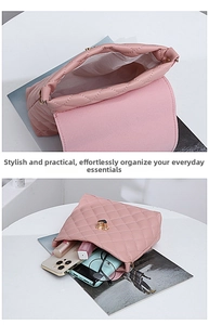 Detail of pink quilted bucket bag showing interior space for phone and makeup