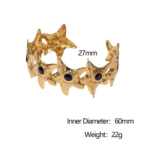 Detail view of 18k gold starfish cuff with black enamel showing 27mm width and dimensions