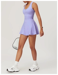 Detail of lavender athletic tennis dress with zipper neckline and pleated A-line skirt