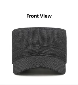 Front view of charcoal grey flat cap with fabric texture and side metal logo detail