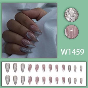 Long stiletto press-on nails with silver glitter and wavy line art designs