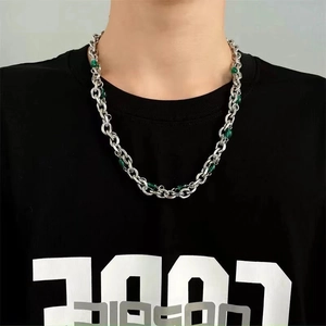 Titanium steel necklace for women with silver chain and green beads on a model