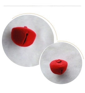 Close-up of a 2.5cm red flocked Christmas bell accessory for DIY wreaths and holiday crafts