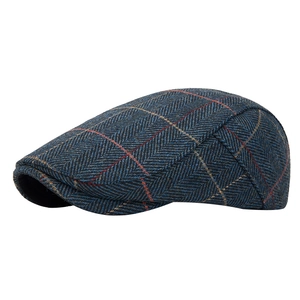 Blue herringbone tweed flat cap with orange and yellow plaid pattern for men