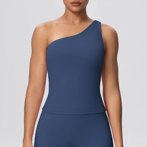 Detail of asymmetric one-shoulder yoga top in matte dark blue high-elasticity fabric