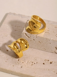Macro shot of 18k gold plated stainless steel ring with chunky irregular fluid design