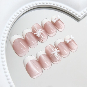 Rosa Cat-Eye-Nägel zum Aufkleben mit weißen French Tips und 3D-Schleifen-Dekor