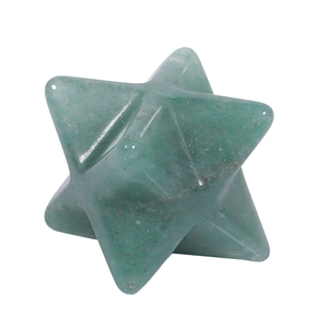 Macro shot of 3D green crystal Merkaba star pendant with polished translucent texture