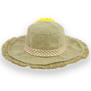 Detail of sunflower decoration and polka dot ribbon on a wide brim straw sun hat