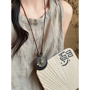 Bohemian wooden leaf pendant necklace with vintage metal hat detail for women
