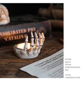 Detail of European skeleton hand candle holder with resin texture for Halloween decor