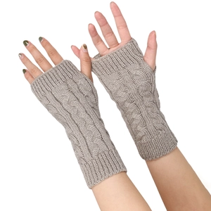 Detailed close-up of cable knit texture on coffee-colored fingerless wrist warmers