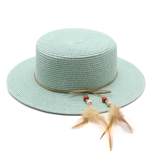 Breathable mint green straw sun hat with decorative brown feathers and colorful beads