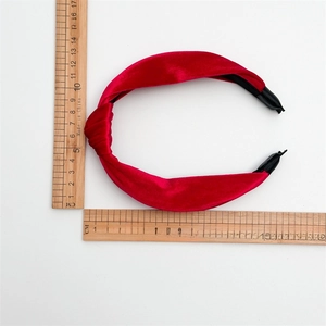 Red velvet knotted headband with measurement scale showing 15cm diameter size