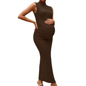 Close-up of sleeveless high neck maternity dress in dark brown stretchy fabric