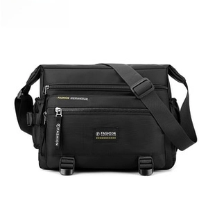 Detail of black waterproof nylon shoulder bag featuring multi-layer zipper compartments