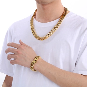 Men's 15mm gold-toned Cuban link necklace and bracelet set worn by a male model