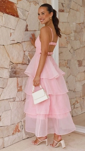 Close-up of pink tiered ruffle cake dress with crisscross back tie and sheer fabric detail