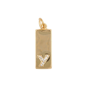 Detail view of rectangular gold pendant with hammered texture and zircon letter Y