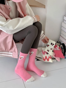 Detail of pink crew socks with white heart and LOVE text embroidery for women