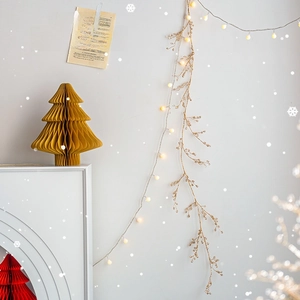 Christmas decoration set with warm LED lights and paper honeycomb trees for festive scenes
