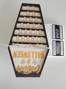 Detailed measurement of wooden coffin Halloween countdown calendar showing size and weight