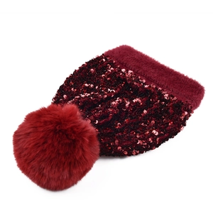 Sparkly burgundy knit beanie for women with a fluffy detachable faux fur pom-pom