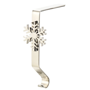 Close-up of a silver snowflake metal mantel clip for Christmas stockings with a polished finish