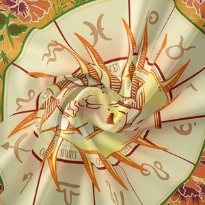 Detailed close-up of zodiac tapestry fabric with Pisces and Leo astrological patterns