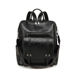 Retro black textured leather backpack with large capacity and woven ethnic strap detail