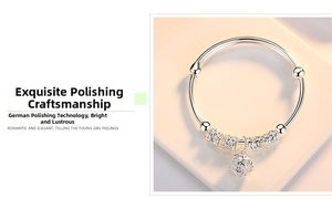 Detail of silver-plated bell bracelet featuring polished hollow transfer beads and adjustable band