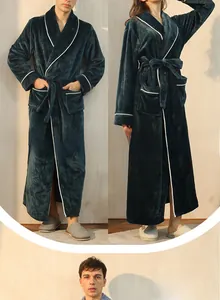 Detail of dark green flannel bathrobe featuring white contrast piping and soft velvet texture